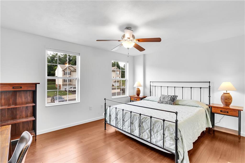 6439 Lindsey Lane Export, PA 15632 - Photo 34 of 39 a bedroom with a bed chandelier and a window