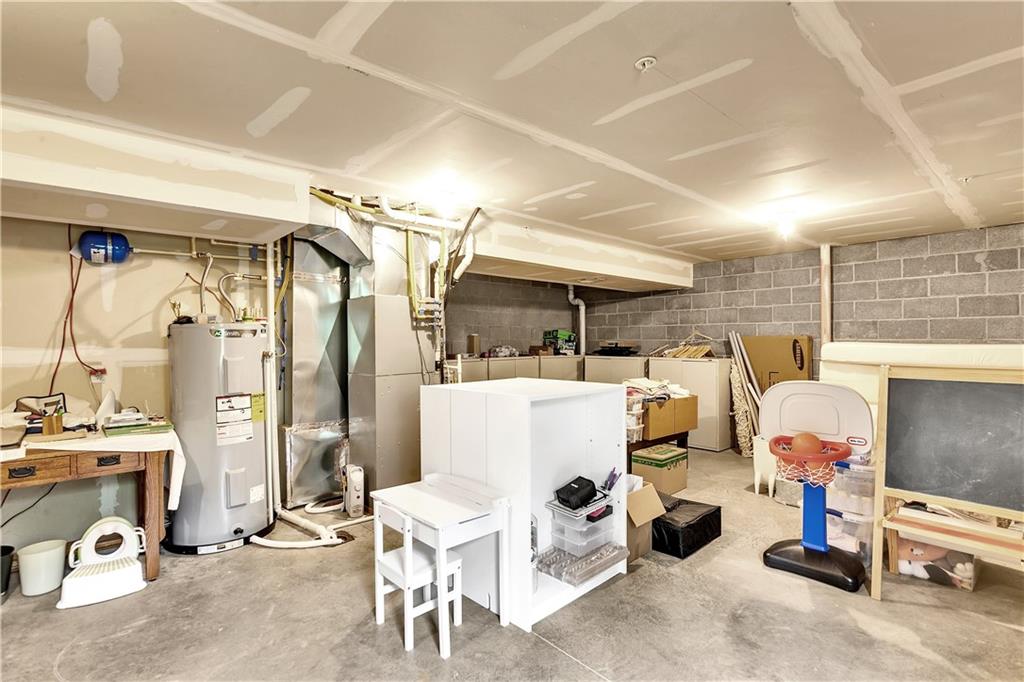 6439 Lindsey Lane Export, PA 15632 - Photo 35 of 39 a living room with lots of furniture and a chandelier