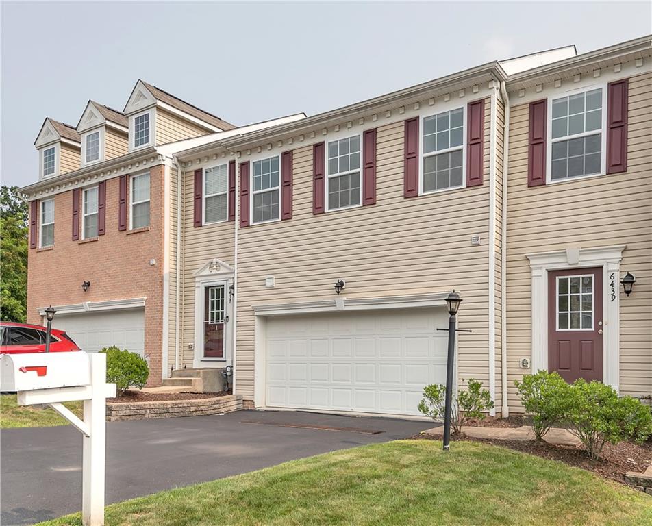 6439 Lindsey Lane Export, PA 15632 - Photo 4 of 39 a front view of a house with a yard and garage