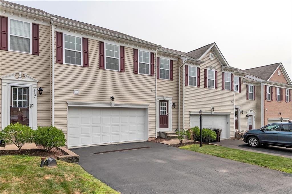 6439 Lindsey Lane Export, PA 15632 - Photo 5 of 39 a front view of a house with a yard and garage