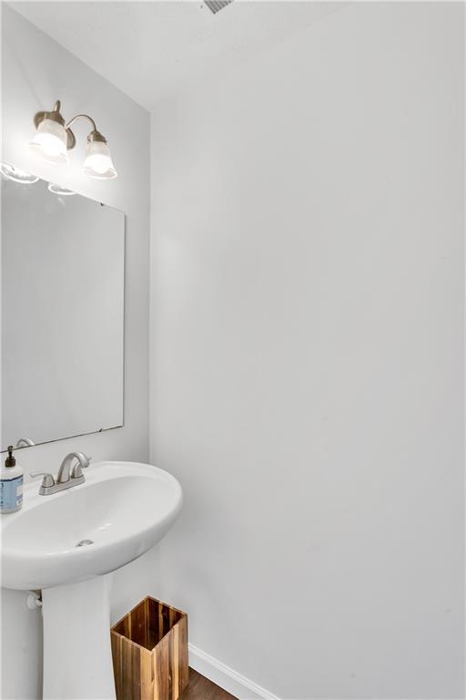 6439 Lindsey Lane Export, PA 15632 - Photo 8 of 39 a bathroom with a sink and a mirror