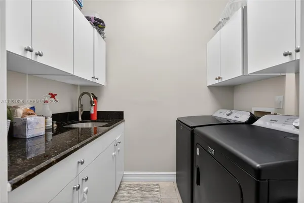 a bedroom with a bed and a flat screen television