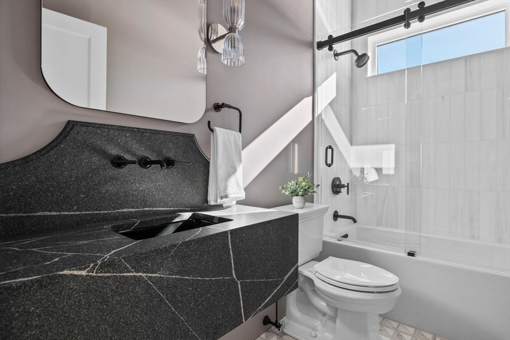 8 Common Court, Unit 8 Lexington, MA 02421 - Photo 6 of 17 a bathroom with a sink a toilet and shower