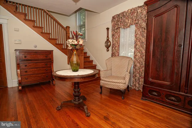 a living room with a stove and a flat screen tv