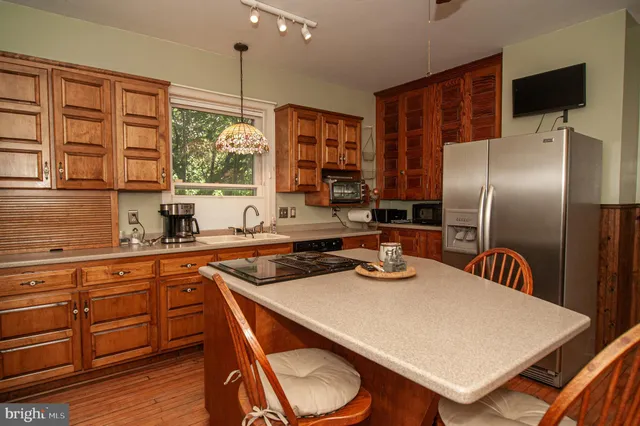 a spacious bathroom with a tub sink and mirror