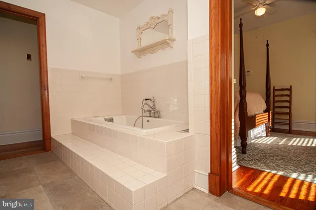 a view of a street with wooden floor and fence