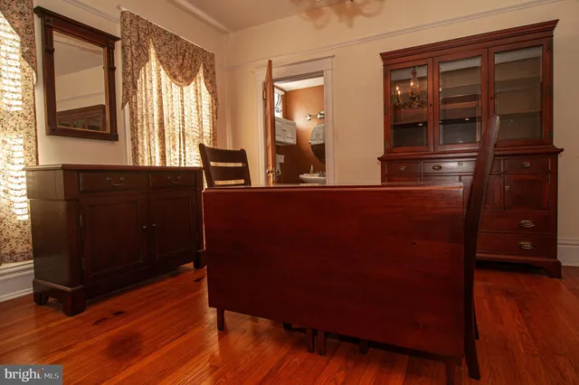 a bedroom with two beds and a chandelier