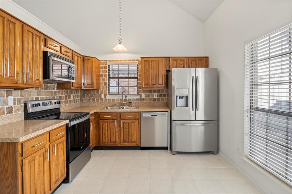 18914 Ravenglen Court Dallas, TX 75287 - Photo 15 of 33 Lots of natural lights, big window in the Kitchen