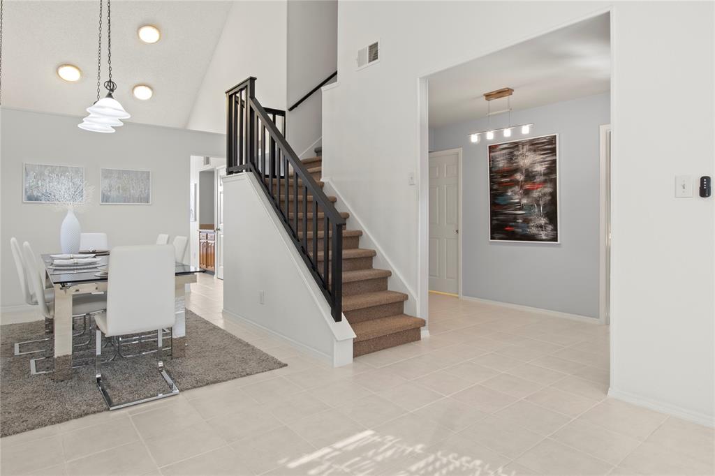 18914 Ravenglen Court Dallas, TX 75287 - Photo 7 of 33 Elegant staircase leads to the second floor