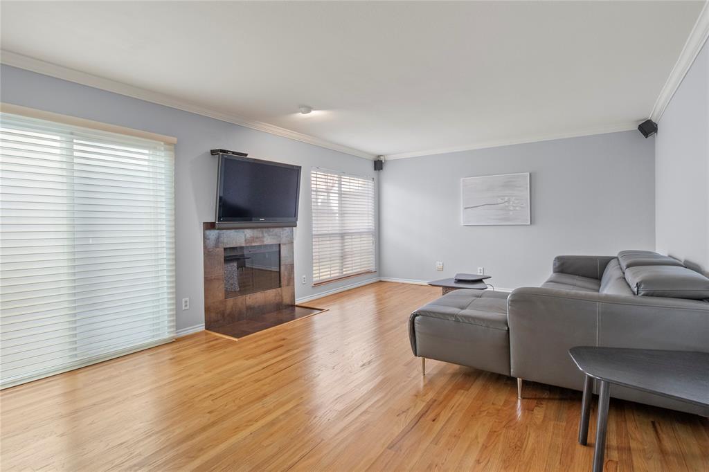 18914 Ravenglen Court Dallas, TX 75287 - Photo 10 of 33 Cozy fireplace in the Family room