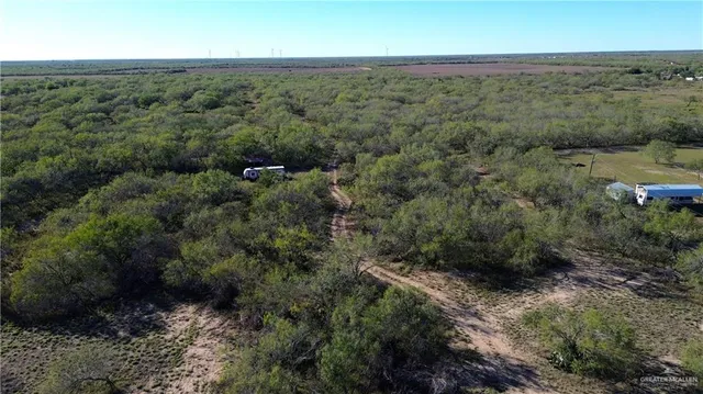 an aerial view of beach with yard