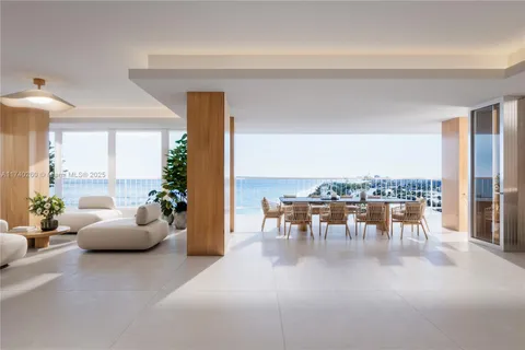 a hallway with furniture and a large window