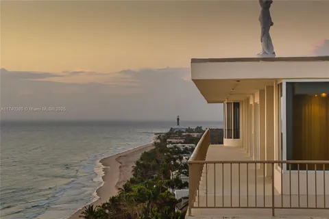a view of ocean with a multi story building