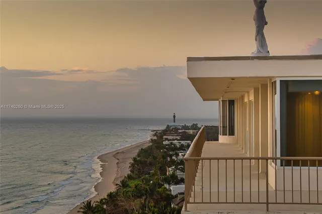 a view of ocean with a multi story building