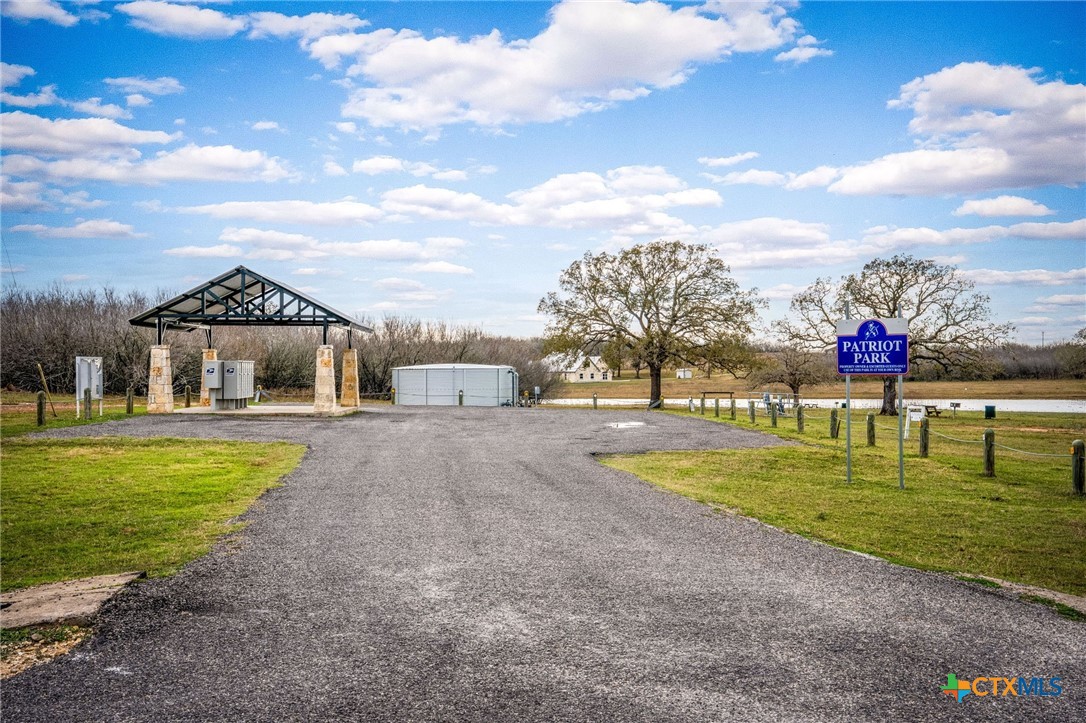 38 Settlement Way Luling, TX 78648 - Photo 17 of 23 a front view of a house with a yard and trees