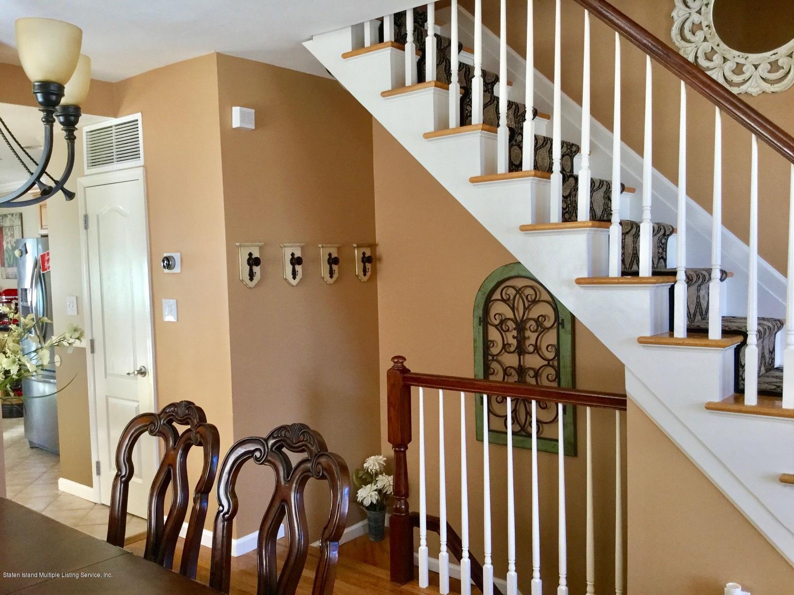 16 Ralph Avenue Staten Island, NY 10312 - Photo 6 of 38 living room stairs