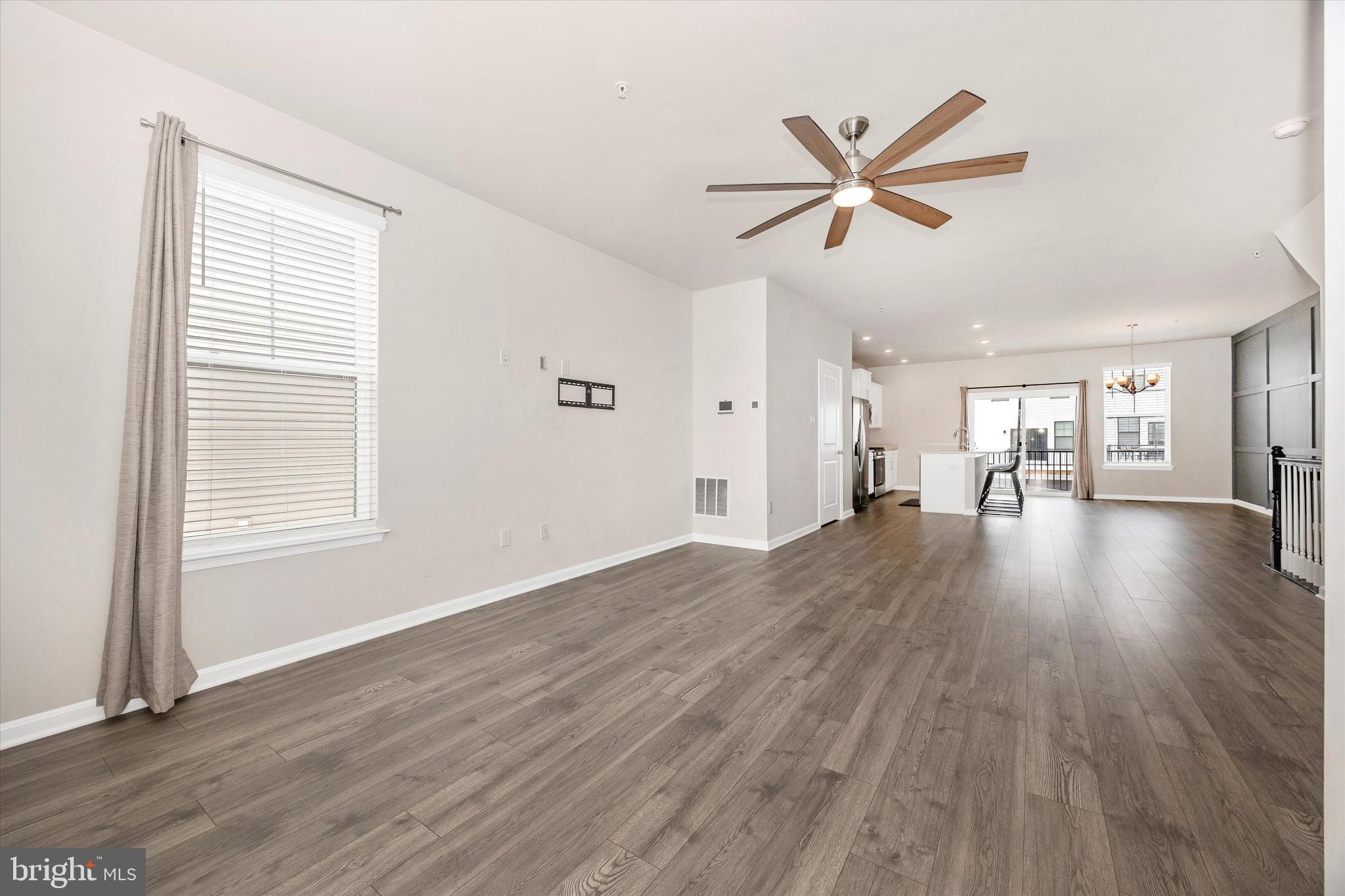 270 Ensemble Way Frederick, MD 21701 - Photo 12 of 43 a view of a livingroom with wooden floor and a ceiling fan