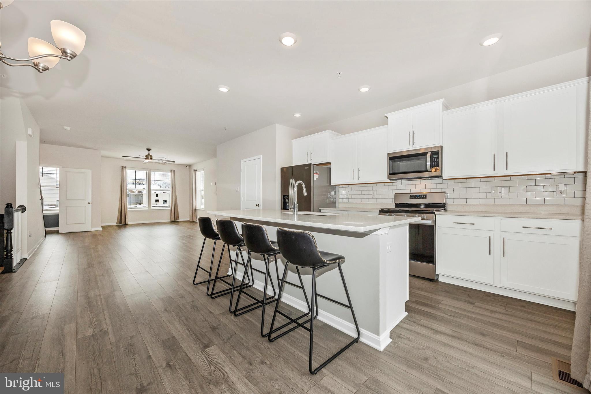 270 Ensemble Way Frederick, MD 21701 - Photo 15 of 43 a kitchen with a sink cabinets and wooden floor