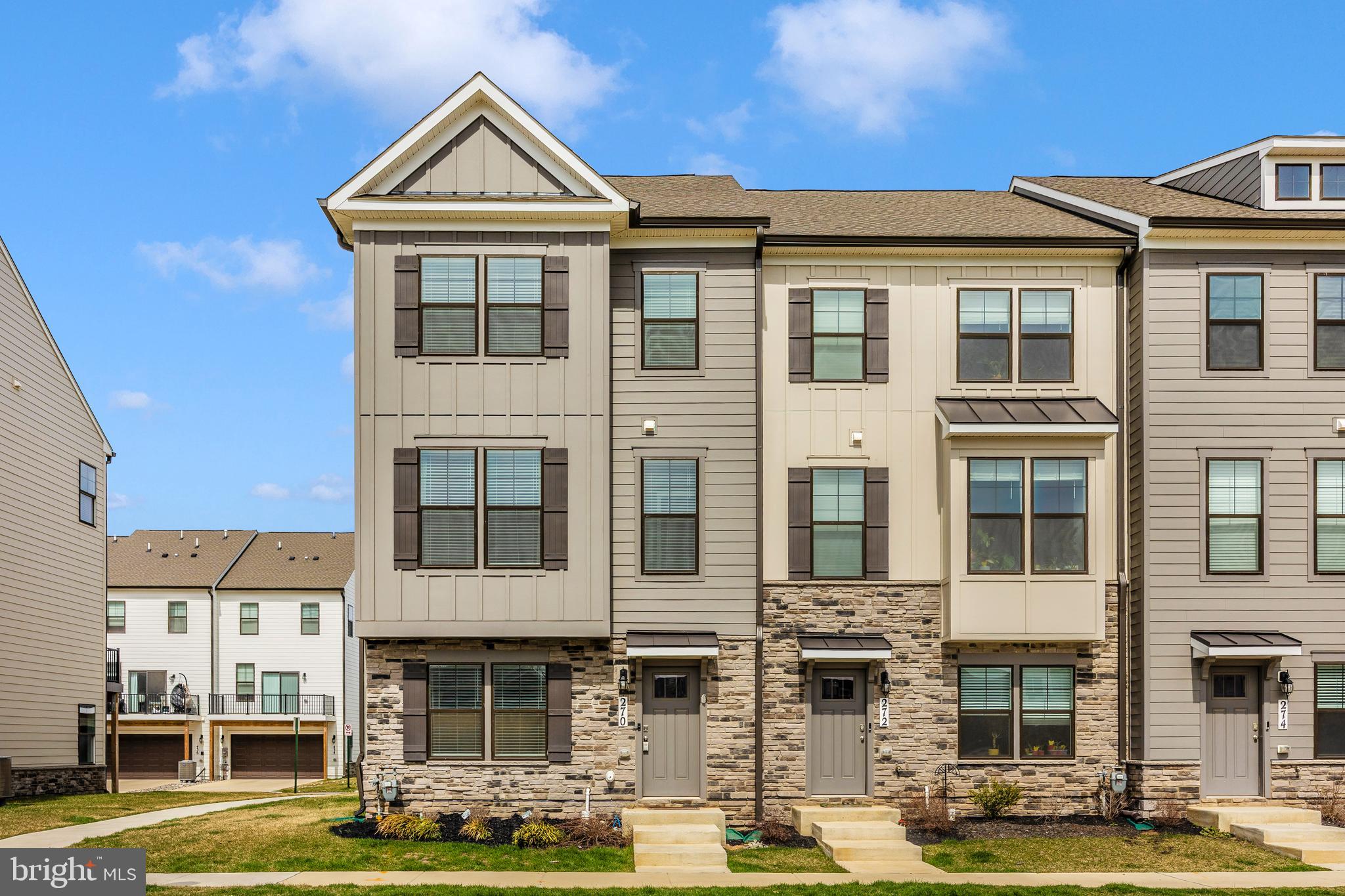 270 Ensemble Way Frederick, MD 21701 - Photo 2 of 43 a front view of a building with street view and tall trees