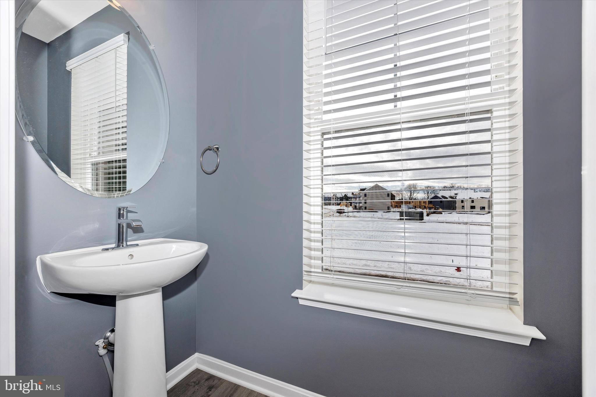 270 Ensemble Way Frederick, MD 21701 - Photo 25 of 43 a bathroom with a sink a mirror and a window