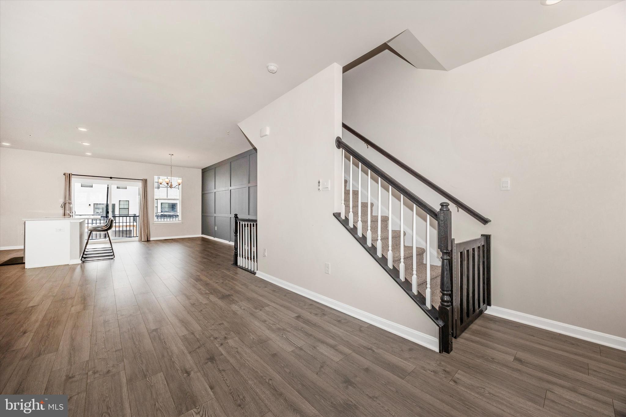 270 Ensemble Way Frederick, MD 21701 - Photo 26 of 43 a view of a hallway with wooden floor and staircase