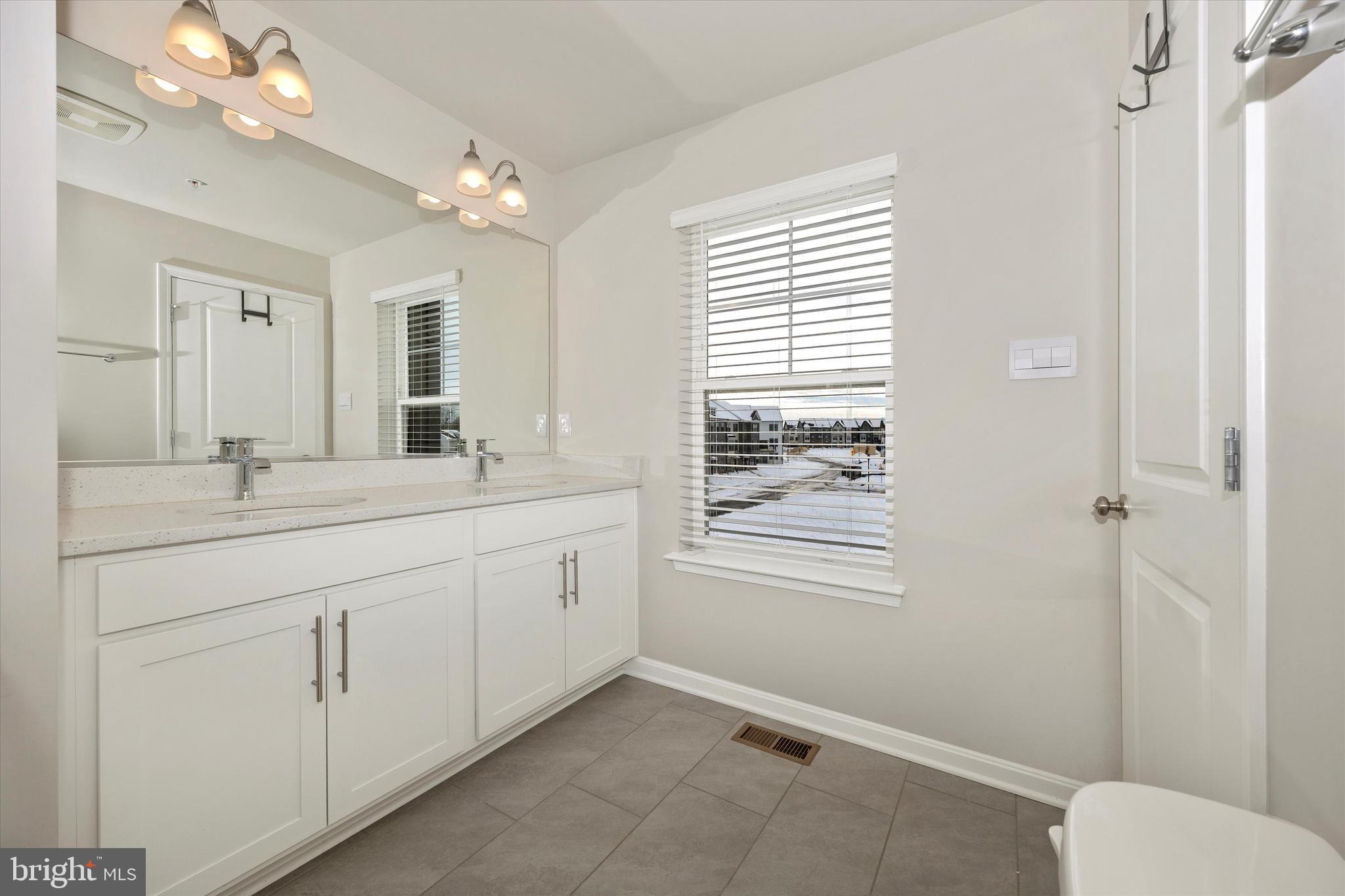 270 Ensemble Way Frederick, MD 21701 - Photo 31 of 43 a bathroom with a double vanity sink and a mirror