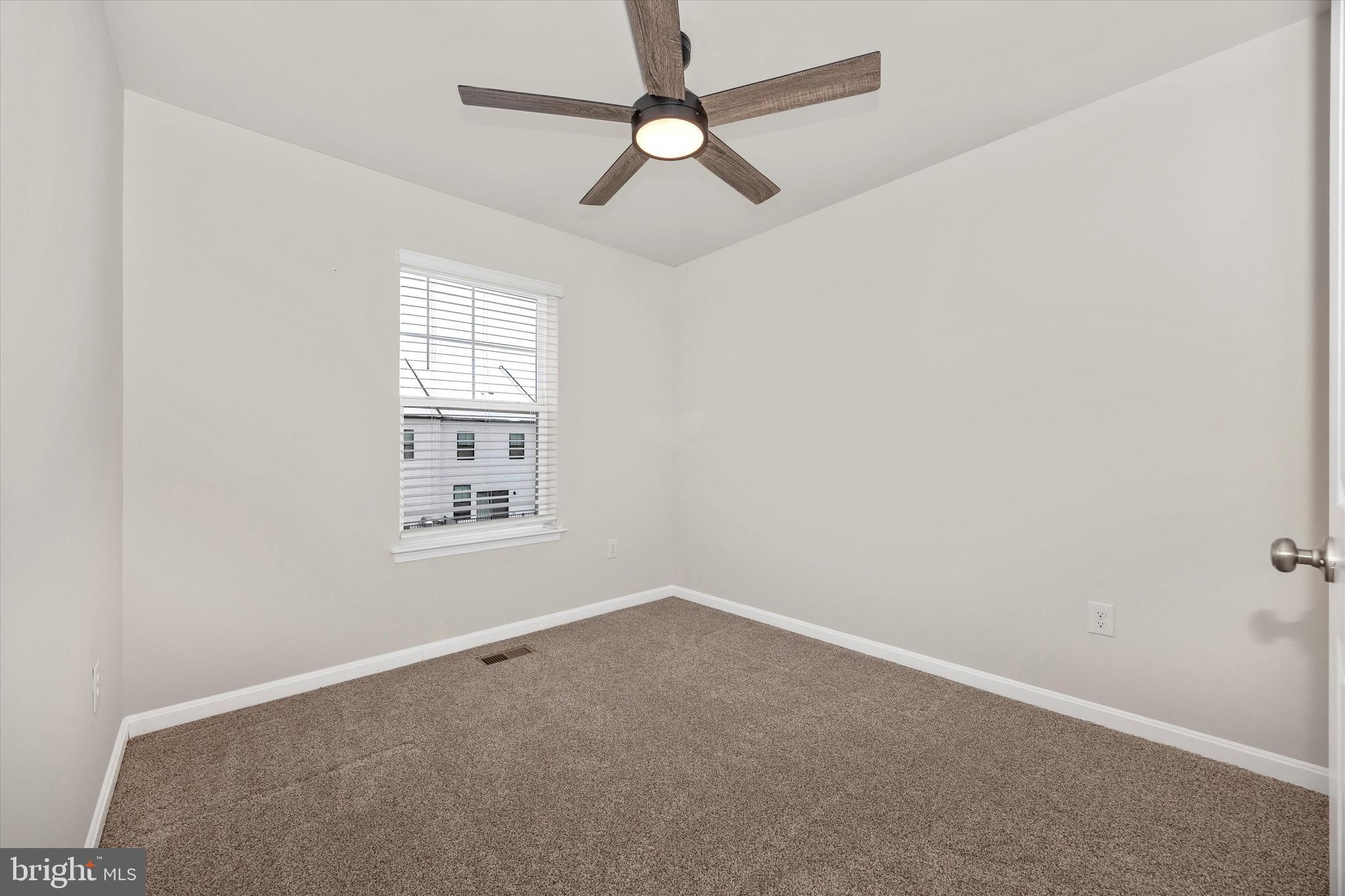 270 Ensemble Way Frederick, MD 21701 - Photo 37 of 43 an empty room with a window and ceiling fan