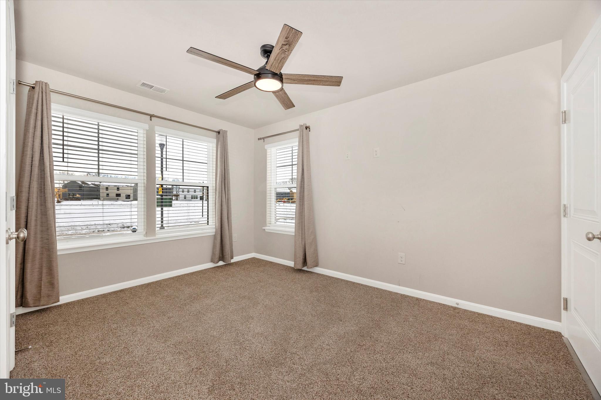 270 Ensemble Way Frederick, MD 21701 - Photo 4 of 43 an empty room with windows and fan
