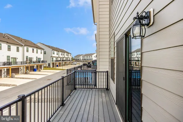 a view of a balcony with wooden floor