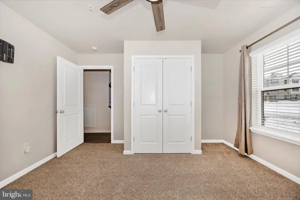 a view of an empty room with a window