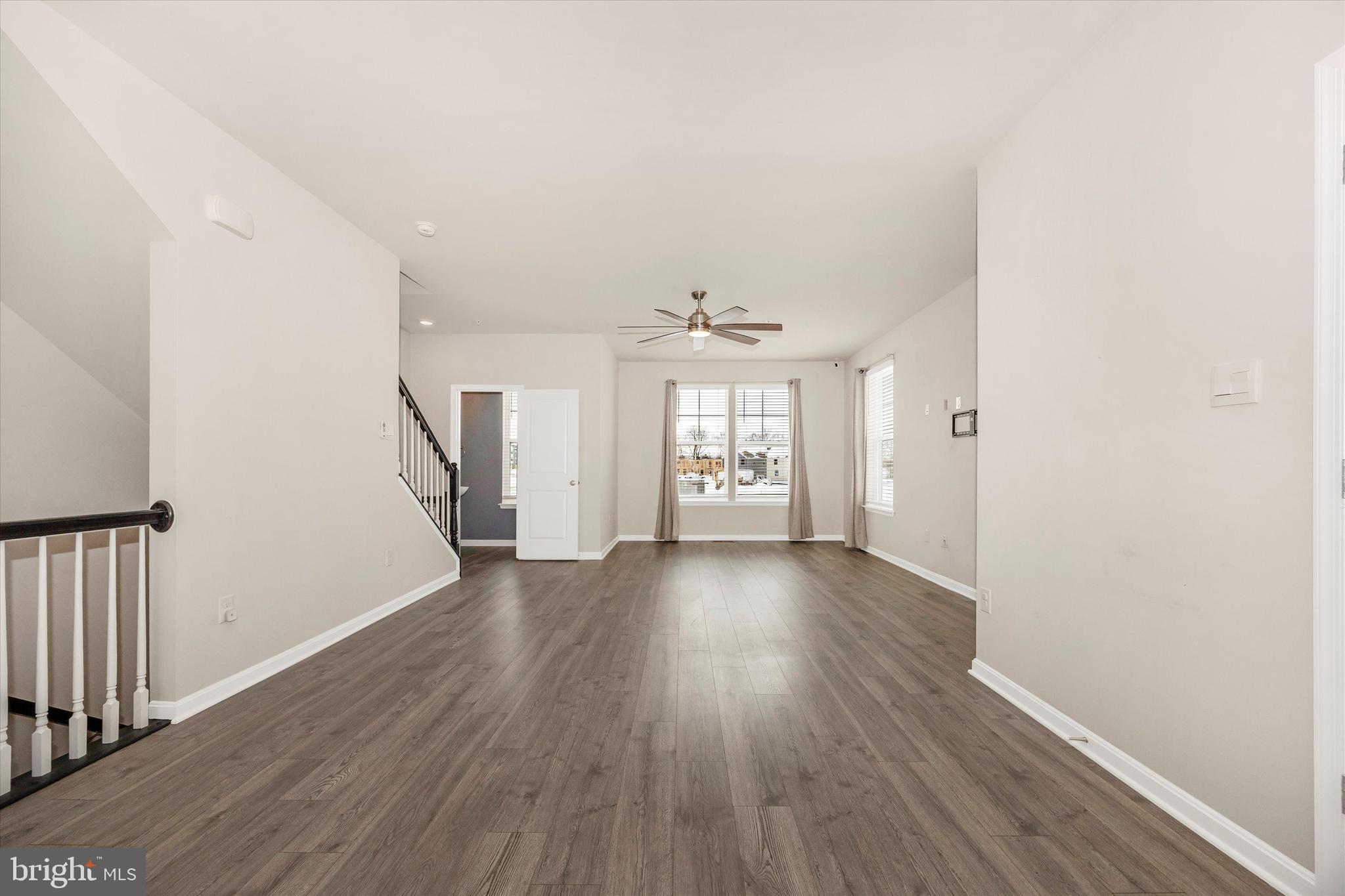 270 Ensemble Way Frederick, MD 21701 - Photo 9 of 43 wooden floor in an empty room with a window
