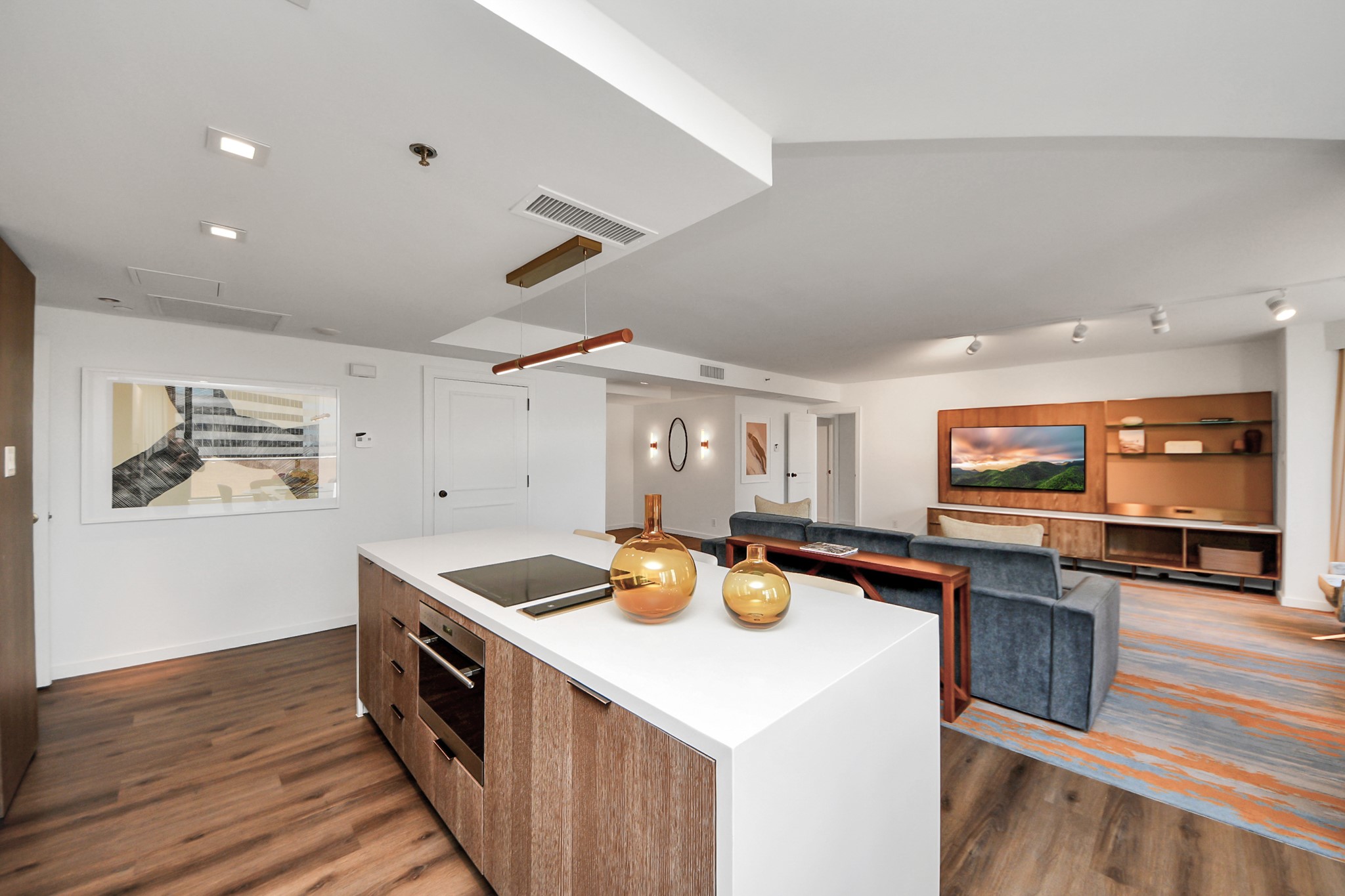 a kitchen with stainless steel appliances a stove a sink and a microwave