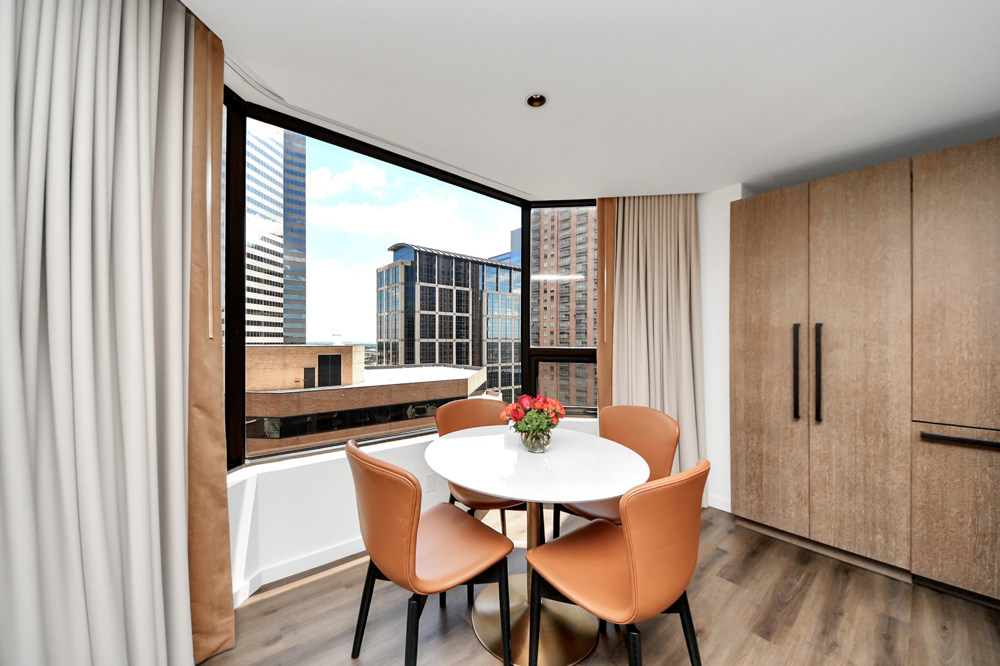 1300 Lamar Street, Unit S3 Houston, TX 77010 - Photo 15 of 50 a view of a dining room with furniture window and wooden floor