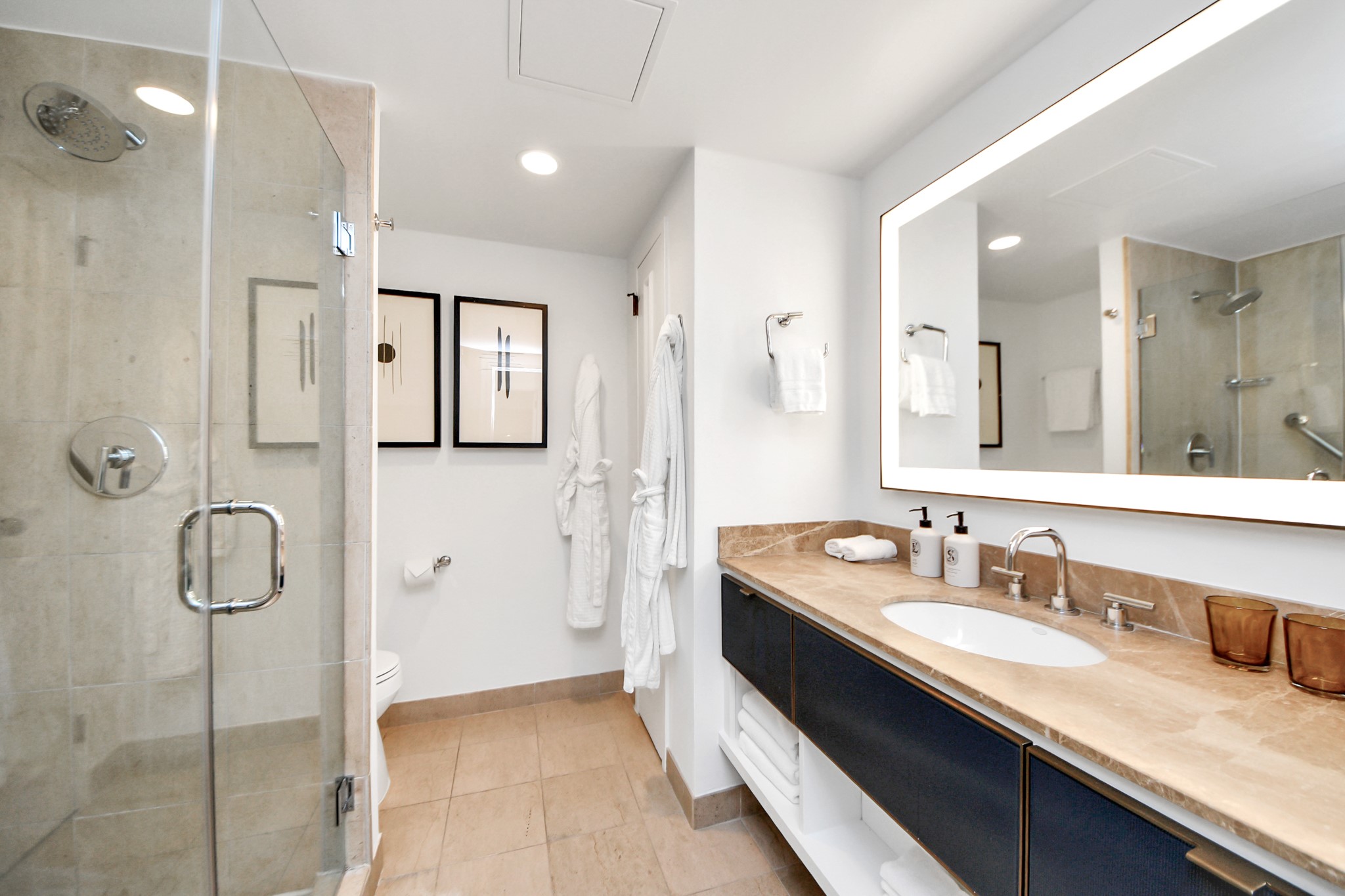 1300 Lamar Street, Unit S3 Houston, TX 77010 - Photo 27 of 50 a spacious bathroom with a granite countertop sink mirror and shower