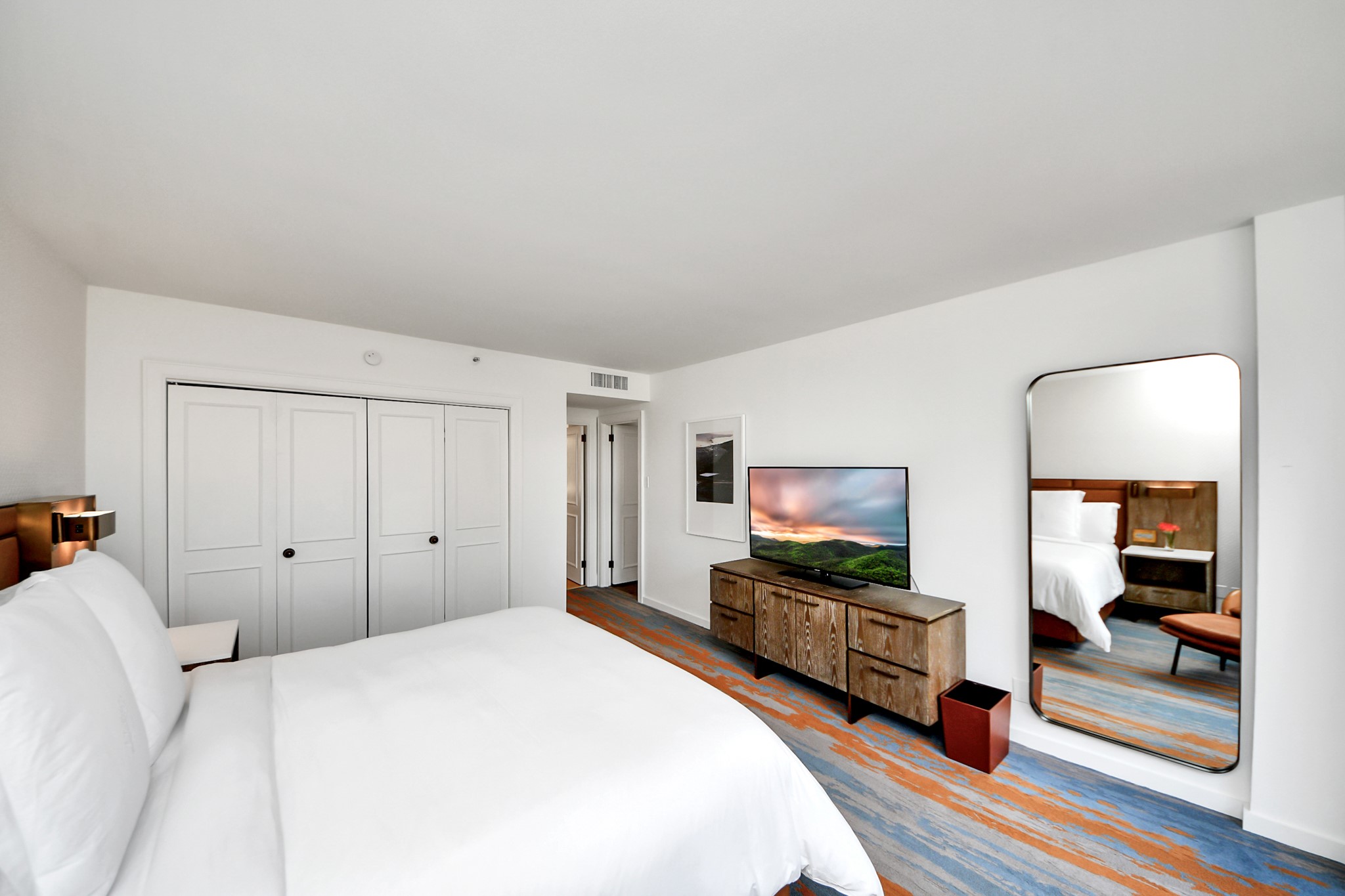 1300 Lamar Street, Unit S3 Houston, TX 77010 - Photo 34 of 50 a bedroom with a bed and a large mirror