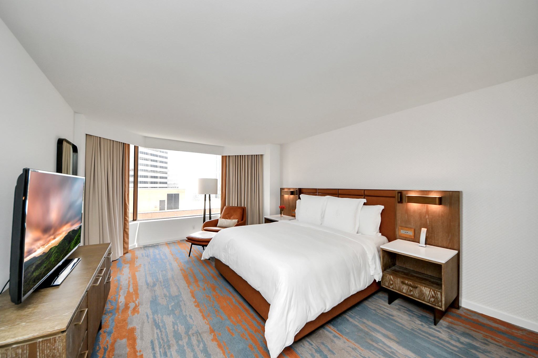 1300 Lamar Street, Unit S3 Houston, TX 77010 - Photo 38 of 50 a bedroom with a bed and a flat screen tv