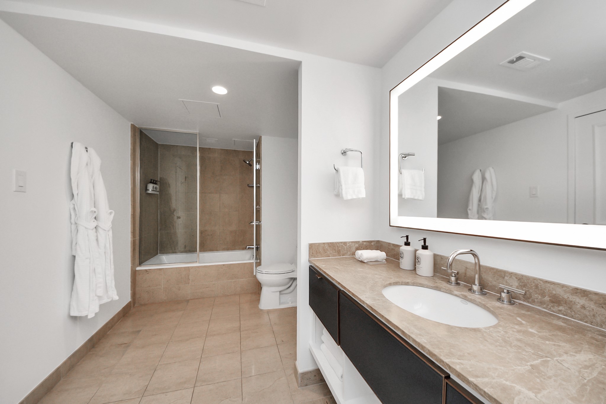 1300 Lamar Street, Unit S3 Houston, TX 77010 - Photo 42 of 50 a bathroom with a granite countertop sink mirror and a