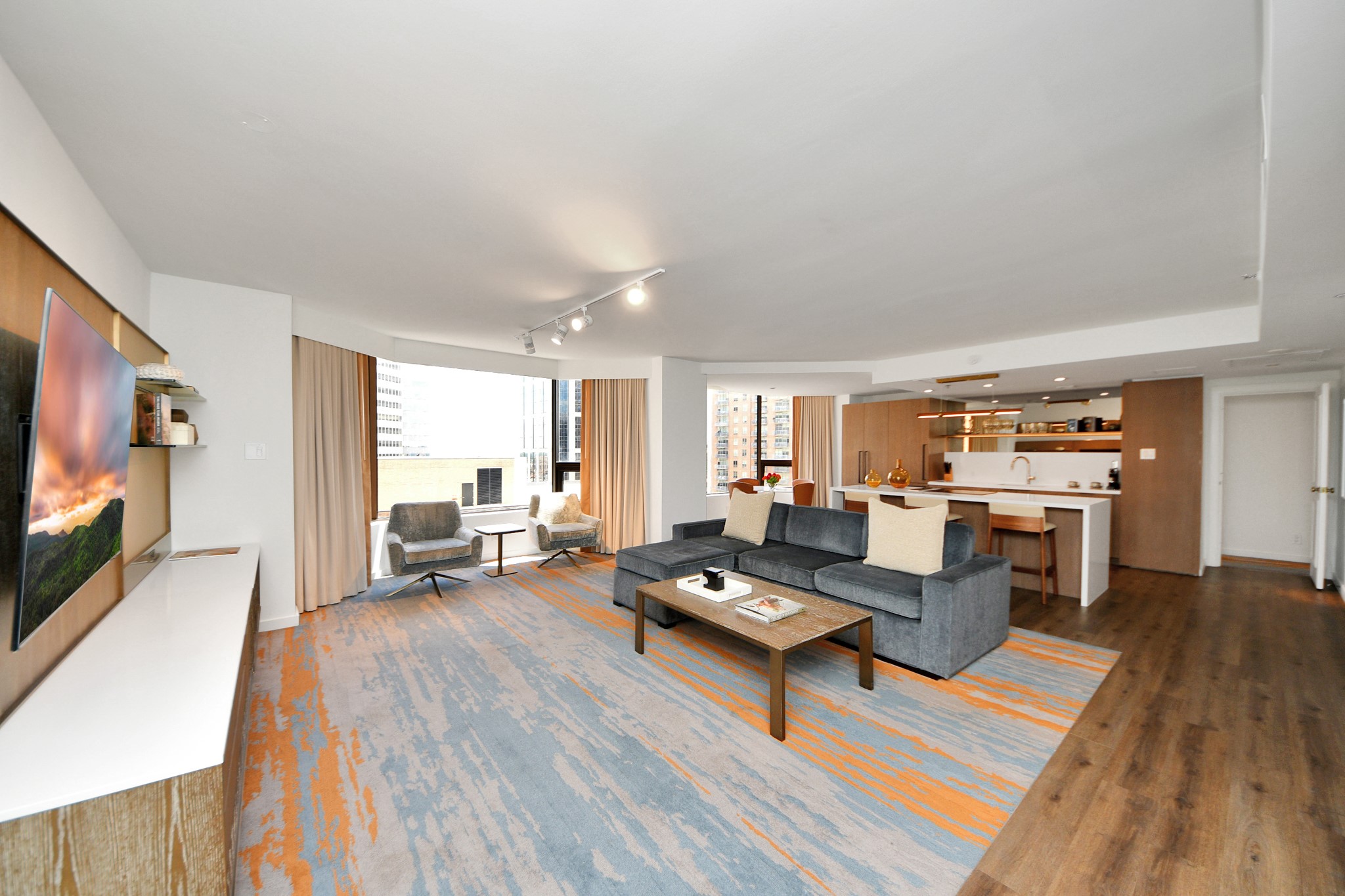 1300 Lamar Street, Unit S3 Houston, TX 77010 - Photo 9 of 50 a living room with furniture and a flat screen tv