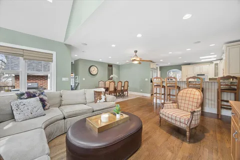 a living room with furniture and kitchen view