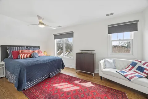 a bedroom with a bed and a couch