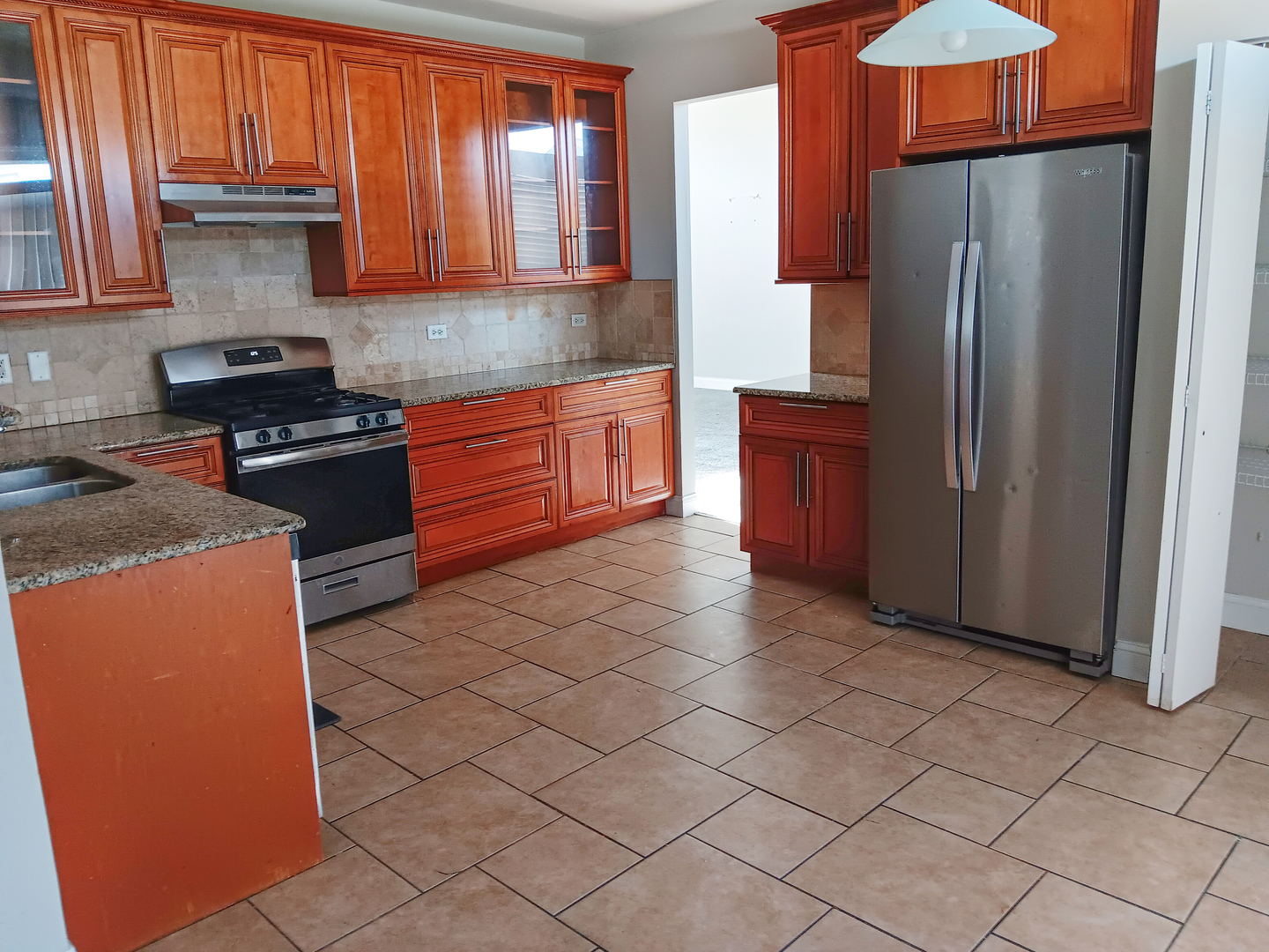 6424 Pasture Side Trail Matteson, IL 60443 - Photo 3 of 9 a kitchen with stainless steel appliances granite countertop a refrigerator a stove and a sink