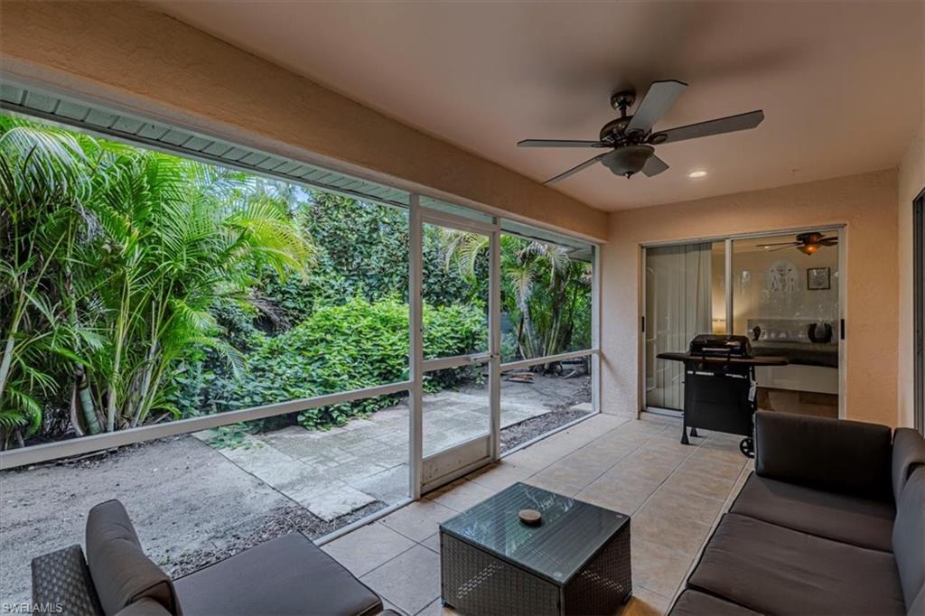 3609 Corinthian Way Naples, FL 34105 - Photo 21 of 23 Living room featuring tile patterned floors, a ceiling fan, and recessed lighting