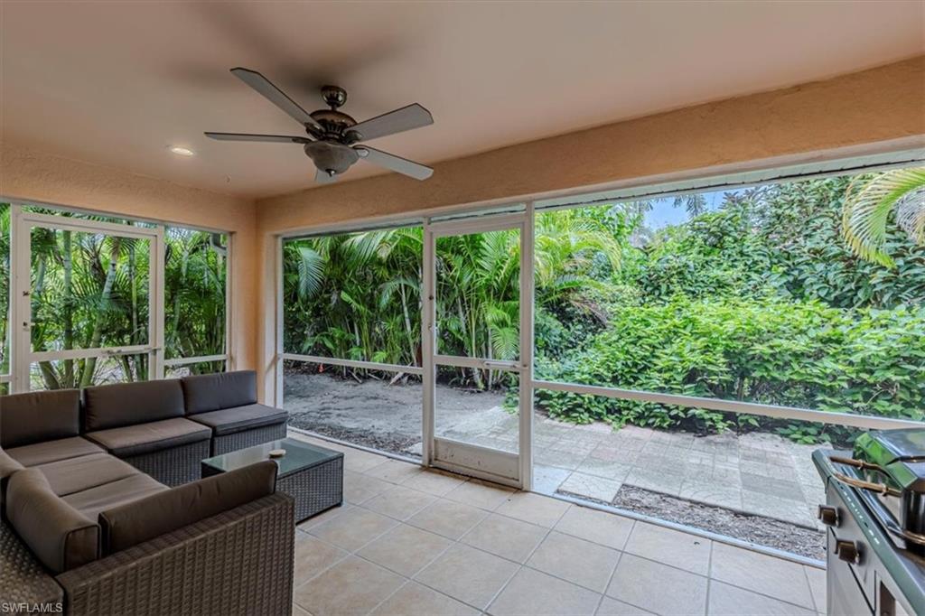 3609 Corinthian Way Naples, FL 34105 - Photo 22 of 23 Sunroom with tile patterned floors and recessed lighting