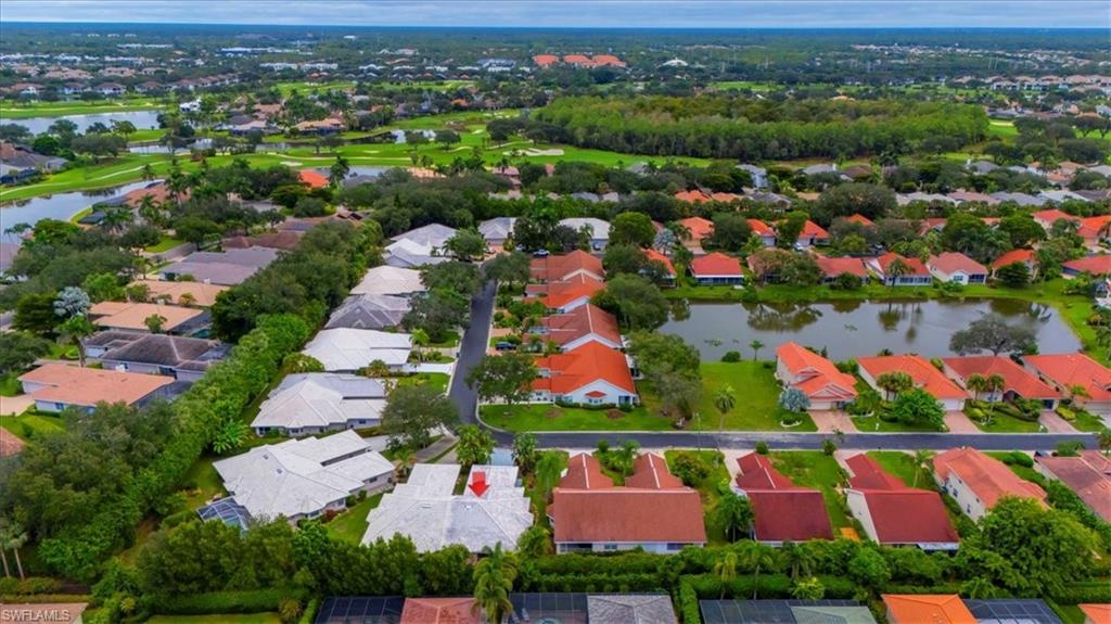 3609 Corinthian Way Naples, FL 34105 - Photo 3 of 23 Aerial perspective of suburban area with a nearby body of water