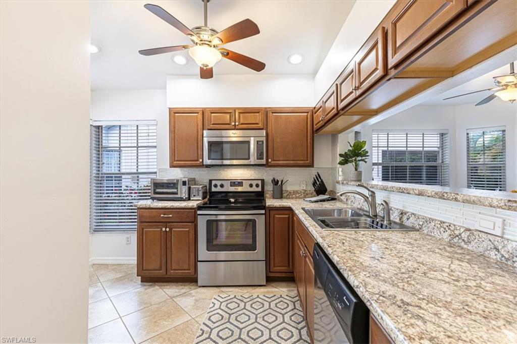 3609 Corinthian Way Naples, FL 34105 - Photo 5 of 23 Kitchen featuring ceiling fan, decorative backsplash, appliances with stainless steel finishes, plenty of natural light, and recessed lighting