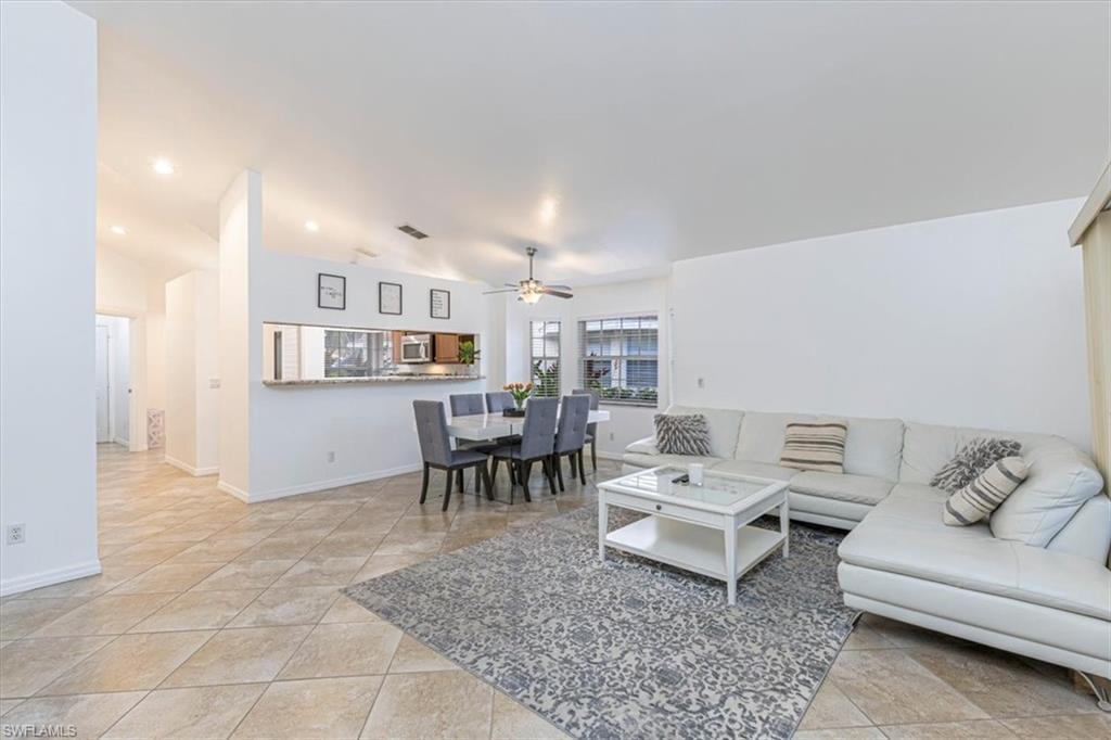 3609 Corinthian Way Naples, FL 34105 - Photo 10 of 23 Living room with a ceiling fan, recessed lighting, and light tile patterned flooring