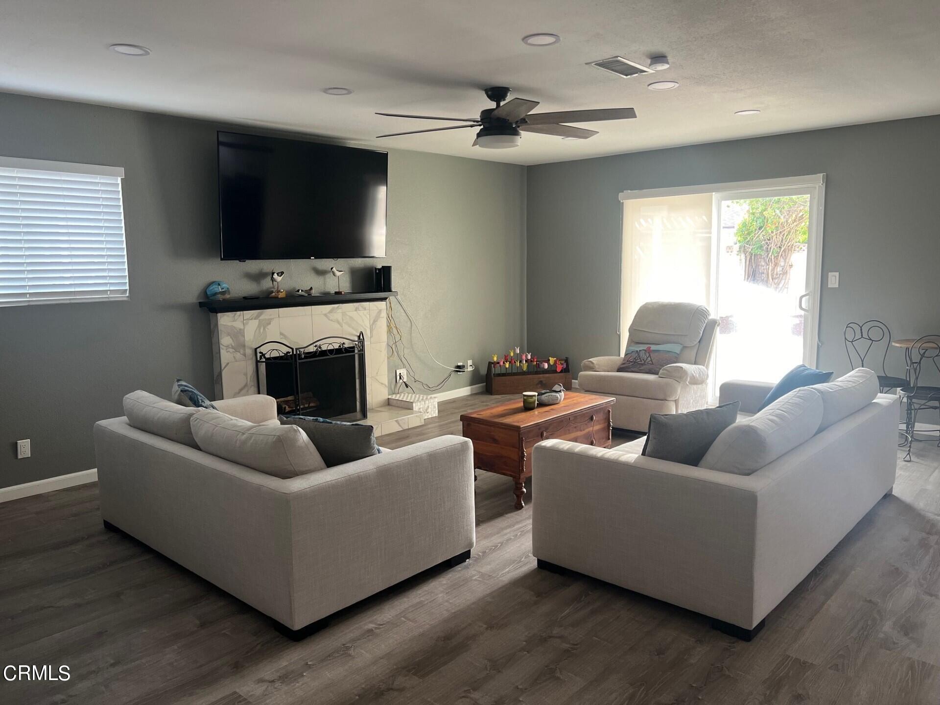 2700 Altus Way Oxnard, CA 93035 - Photo 3 of 10 a living room with furniture and a fireplace