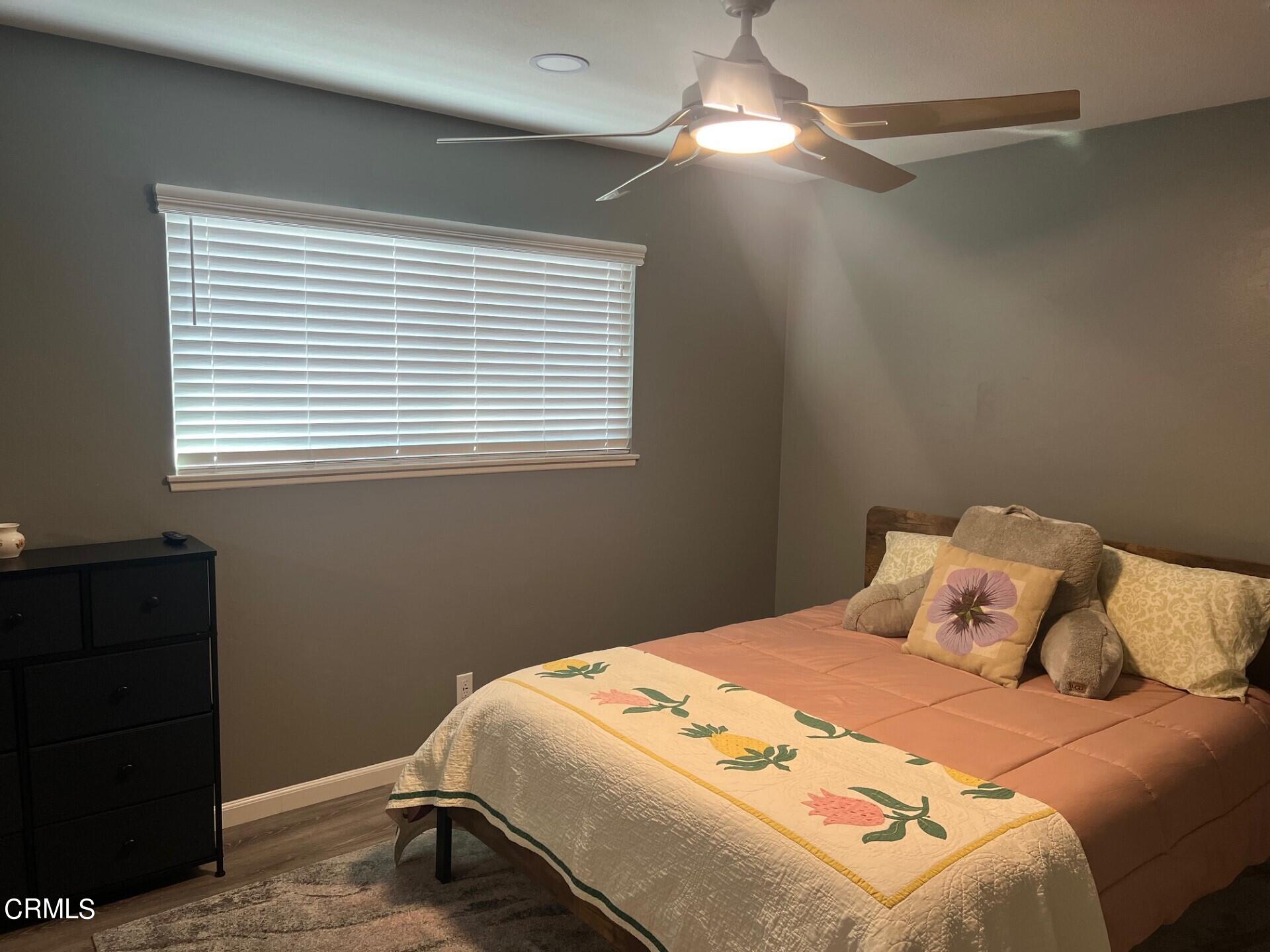 2700 Altus Way Oxnard, CA 93035 - Photo 7 of 10 a bedroom with a bed and a window