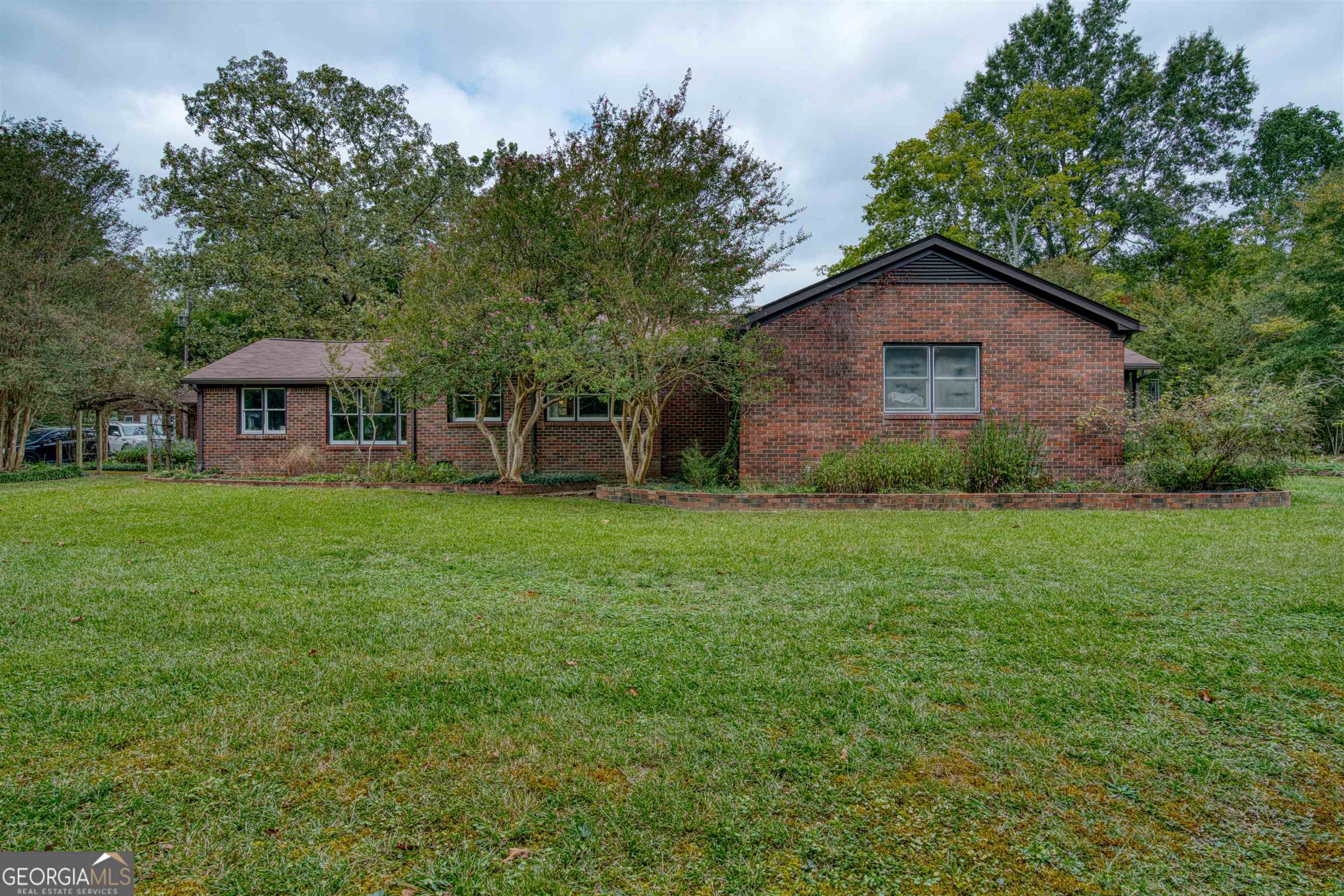 6784 Blacks Bluff Road Southwest Cave Spring, GA 30124 - Photo 1 of 1 a view of a house with a yard