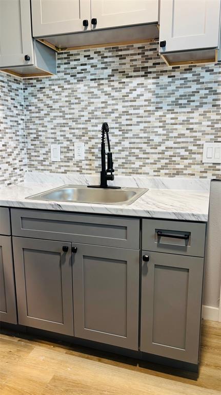 4603 Junius Street, Unit 4 Dallas, TX 75246 - Photo 6 of 14 a kitchen with a sink and cabinets